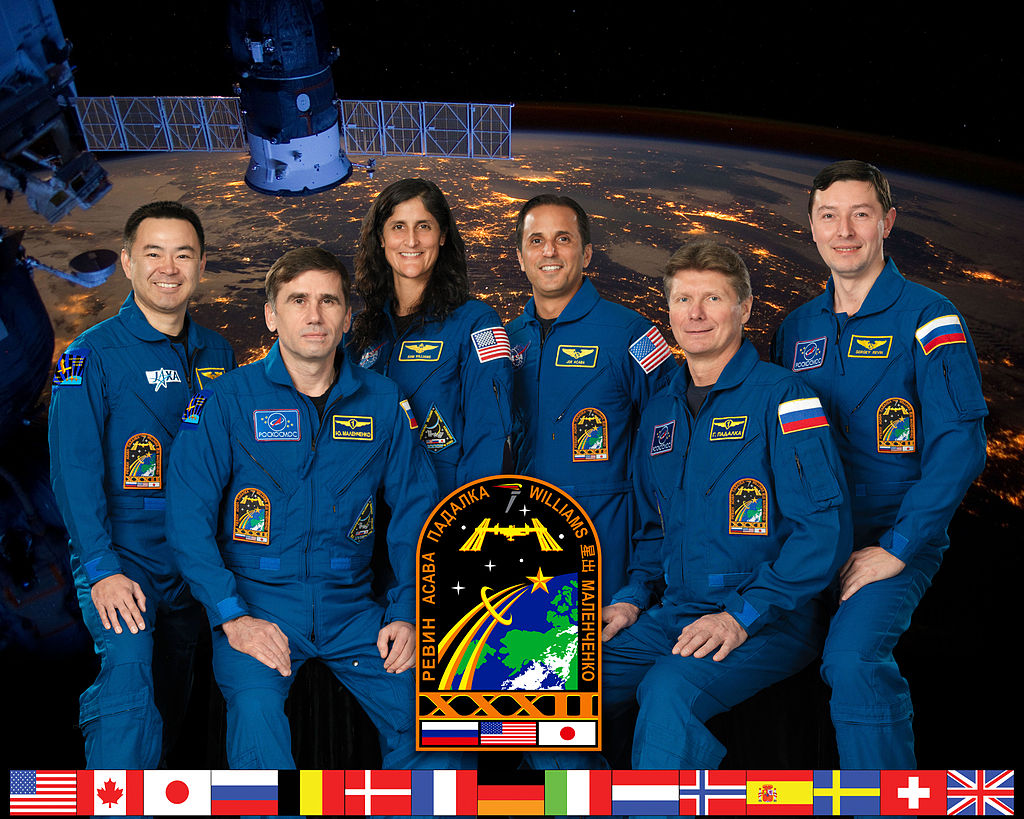 A group of people in uniform posing for a photo Description automatically generated