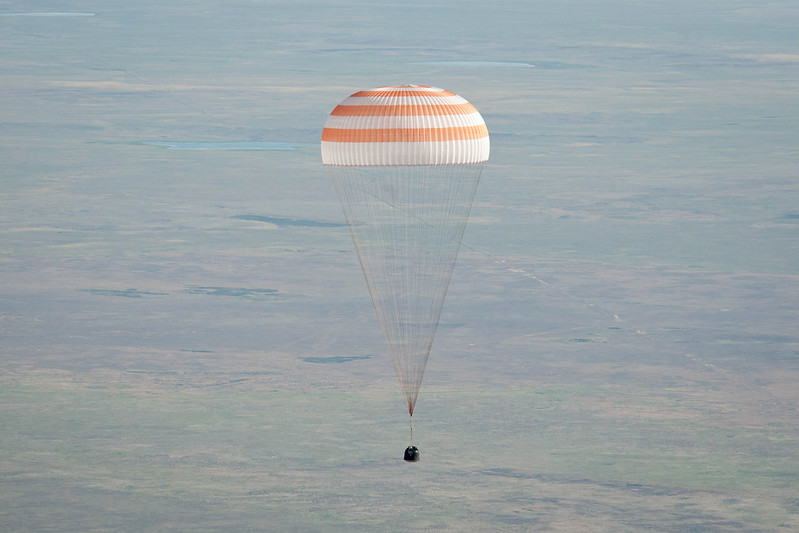 A picture containing water, object, outdoor, parachute Description automatically generated
