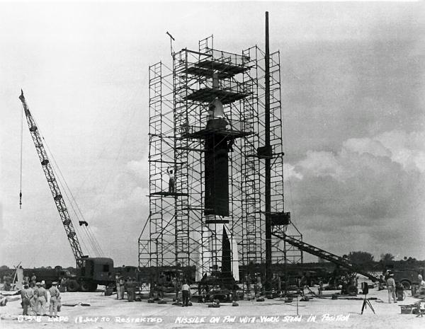 Bumper Launch Preparations At Cape Canaveral. Bumper WAC Rocket. Missile on pad with work stand in position.